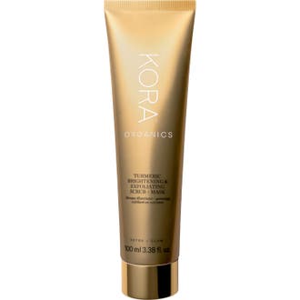 Kora Organics Turmeric Brightening & Exfoliating Scrub + Mask 100 ml on kirkastava kasvonaamio ja kuorinta kultaisessa tuubissa.
