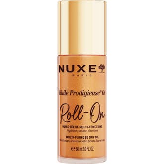 Nuxe Huile Prodigieuse Or Roll-On 60 ml guldolja ansiktsolja ger lyster i en glimmande flaska med guldlock.