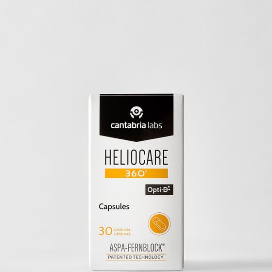 Heliocare Oral Capsules 30 st solskydd inifrån med Fernblock i genomskinlig burk med orangea kapslar och vitt lock.