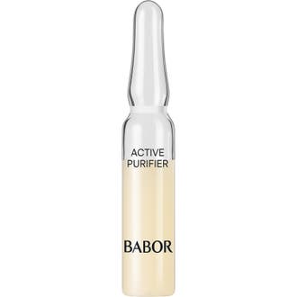 Babor Active Purifier 2 ml ansigtsserum mod urenheder i en klar glasampul med lys gullig væske.
