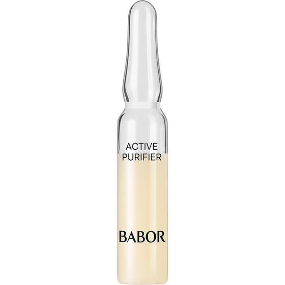 Babor Active Purifier 2 ml puhdistava seerumi kirkkaassa lasiampullissa, joka sisältää vaaleankeltaista nestettä.