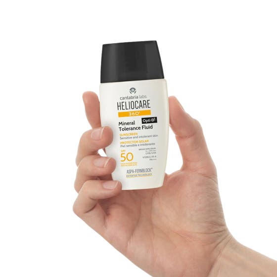 Heliocare Mineral Tolerance Fluid SPF 50 50 ml solcreme til sensitiv hud i hvid papæske med orange detaljer