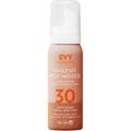 EVY Daily UV Face Mousse evy solskydd ansikte alla hudtyper med spf anti-age i en persikofärgad flaska med vit kork.