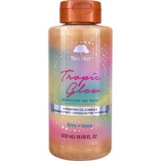 Tree Hut Tropic Glow Sparkling Gel Wash 532 ml ger fasthet och lyster med glittrande guldgel i flaska med regnbågsetikett.