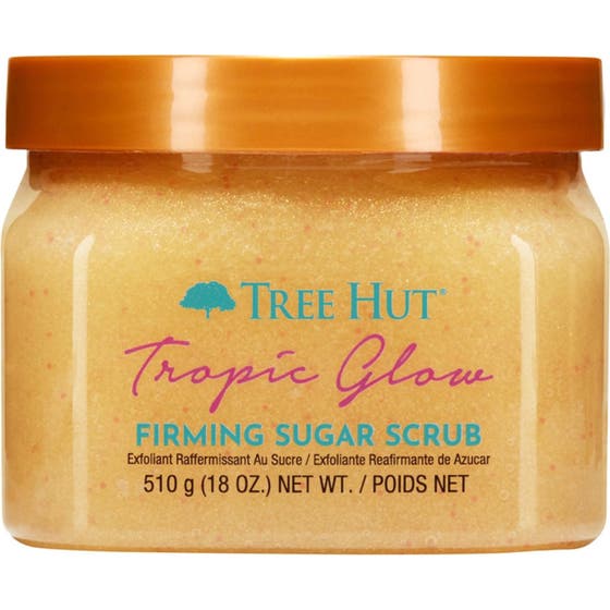 Tree Hut Tropic Glow 510 g exfolierande kroppspeeling i plastburk med gult innehåll och orange lock.