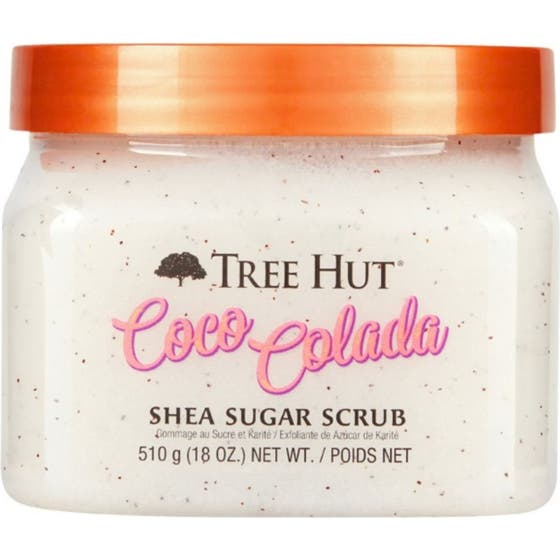 Tree Hut Coco Colada Shea Sugar Scrub 510 g eksfolierende kroppsskrubb i krukke med oransje lokk og hvit kornet tekstur