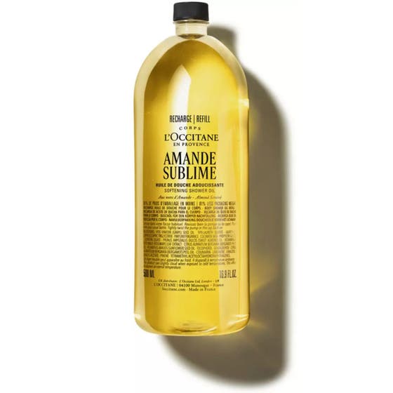 L'Occitane Almond Shower Oil 500ml blødgørende badeolie i en gennemsigtig genanvendelig flaske med gul olie
