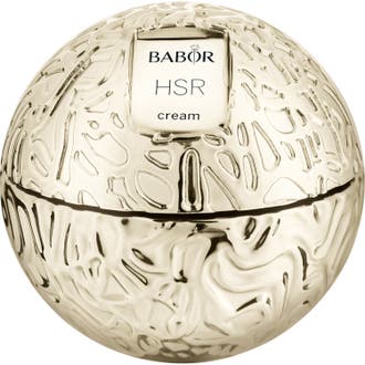 Babor HSR Lifting Cream kiinteyttävä kasvovoide ylellisessä kultaisessa ja kohokuvioidussa pallonmuotoisessa purkissa.
