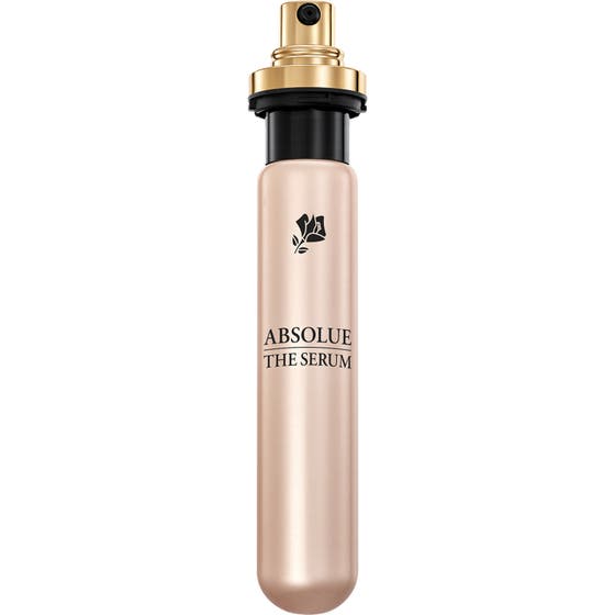 Lancôme Absolue The Serum 30 ml uudistava seerumi kultaisessa metallipullossa sekä kapea täyttöpakkaus pumpulla.