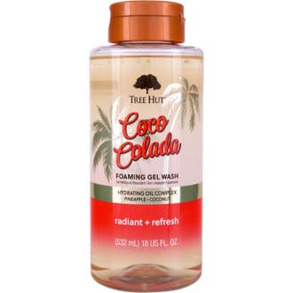 Tree Hut Coco Colada Foaming Gel Wash 532 ml lystergivande kroppsrengöring i genomskinlig flaska med kopparfärgat lock.