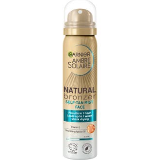 Garnier Ambre Solaire Natural Bronzer 75ml brun utan sol mist ansikte garnier i en bronsfärgad sprayflaska med lock.