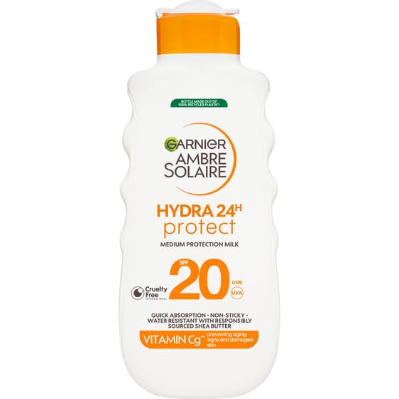 Garnier Ambre Solaire Hydra 24h Protect SPF 20 aurinkovoide valkoisessa aaltomaisessa pullossa oranssilla korkilla