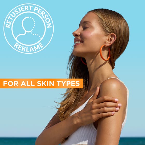 Garnier Ambre Solaire Hydra 24H Protect 175 ml aurinkosuojavoide nainen nauttimassa auringosta kaikille ihotyypeille.