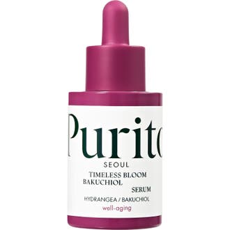 Purito Timeless Bloom Bakuchiol Serum förbättrar hudelasticitet i en lila glasflaska med vit etikett och pipett.
