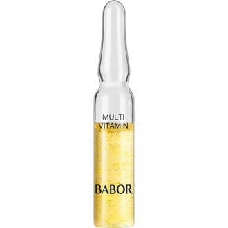 Babor Multi Vitamin styrkende ansigtsserum i en enkelt glasampul med en klar gul og boblende konsistens.