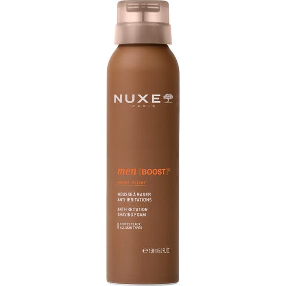 Nuxe Men Boost 150 ml barberskum som motvirker irritasjon i en brun sprayboks med beige kork.