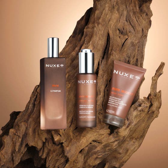 Nuxe Men Multi Action Serum 30 ml gir energi i en brun glassflaske med sølvkork og oransje bånd