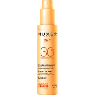 Nuxe Sun Spray SPF30 150 ml ger anti-aging solskydd och hydrering i en hög orange sprayflaska med pump.