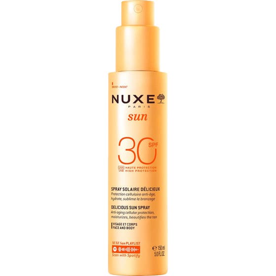 Nuxe Sun SPF 30 Delicious Sun Spray 150 ml beskyttende solspray som gir fuktighet i en oransje flaske med pumpe.