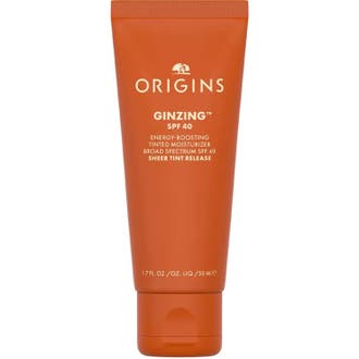 Origins GinZing SPF 40 Tinted Moisturizer 50 ml fugtgivende dagcreme i en klar orange tube med hvidt låg