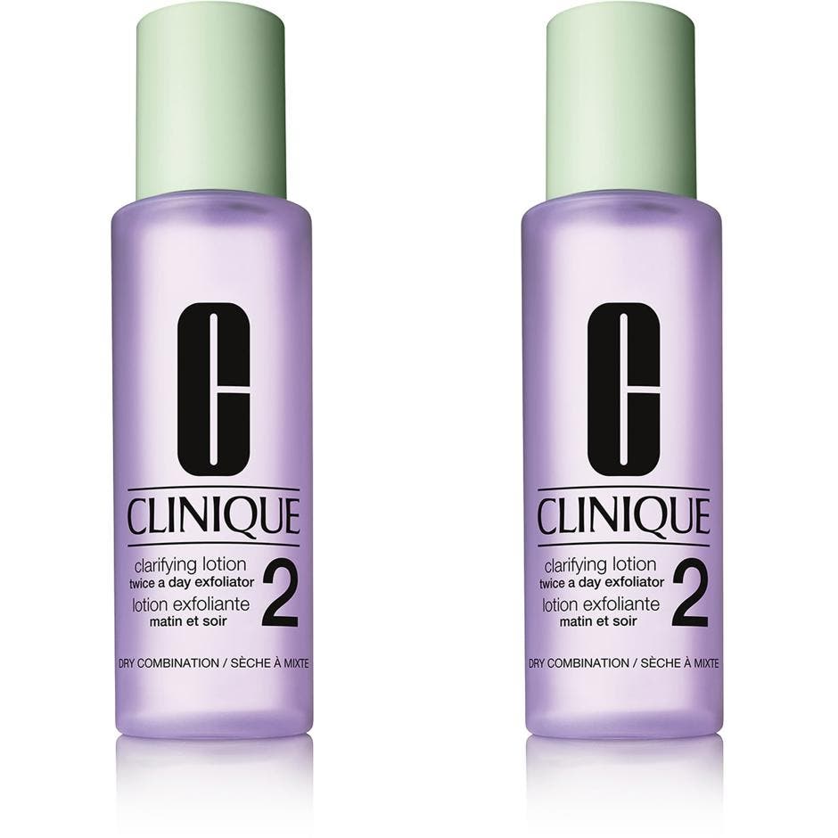 Clinique Clarifying Lotion 2 eksfolierende ansiktsvann i lilla frostet flaske med lysegrønt lokk som gir huden glød.